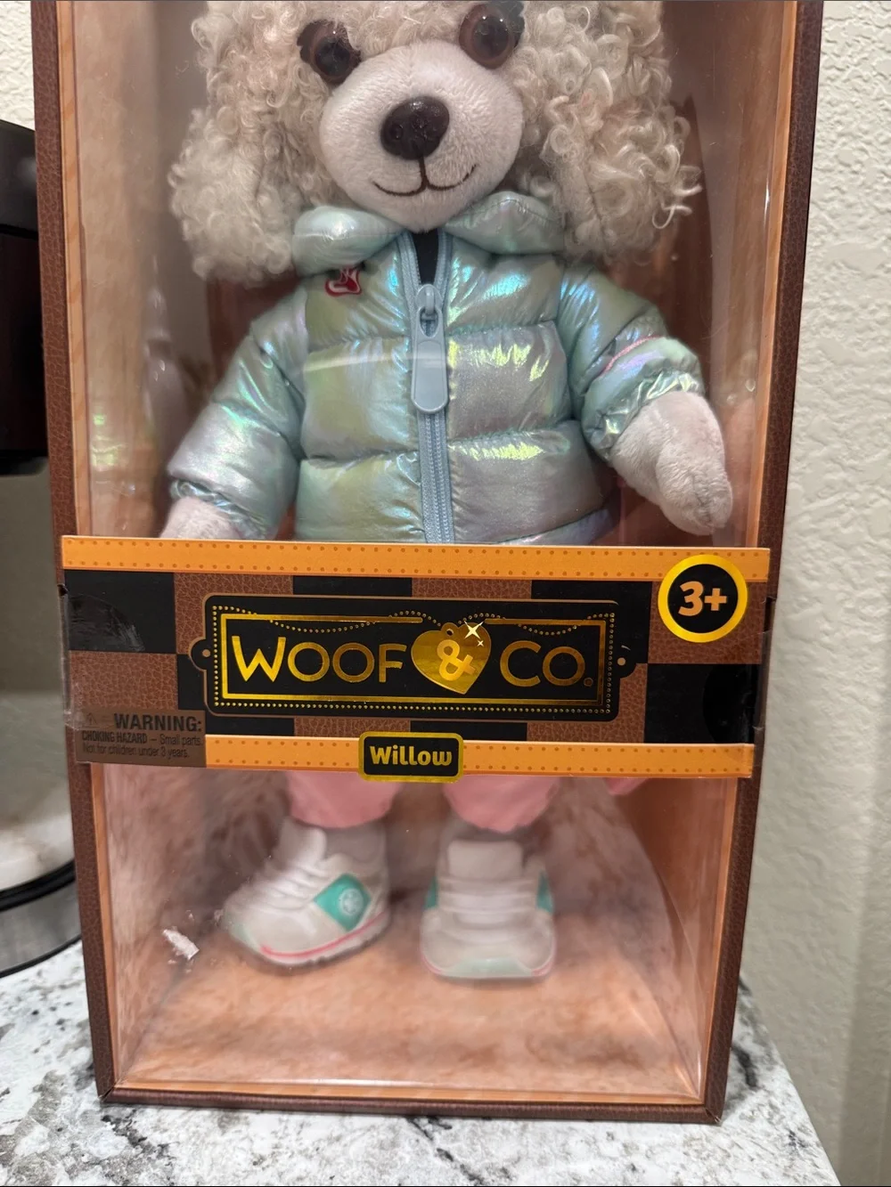 Willow Plush Dog in Iridescent Light Blue Jacket and Cream Knit Hat